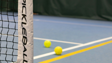 indoor tennis court net and balls