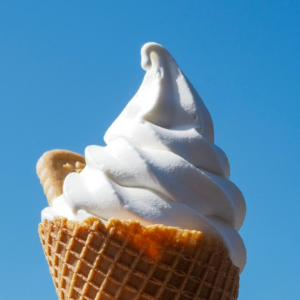 vanilla soft serve cone under blue sky