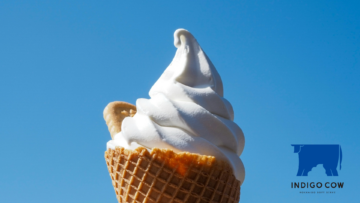 vanilla soft serve cone under blue sky