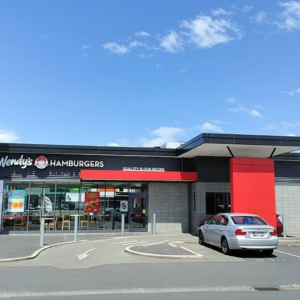 wendy’s restaurant exterior with sign and parking lot