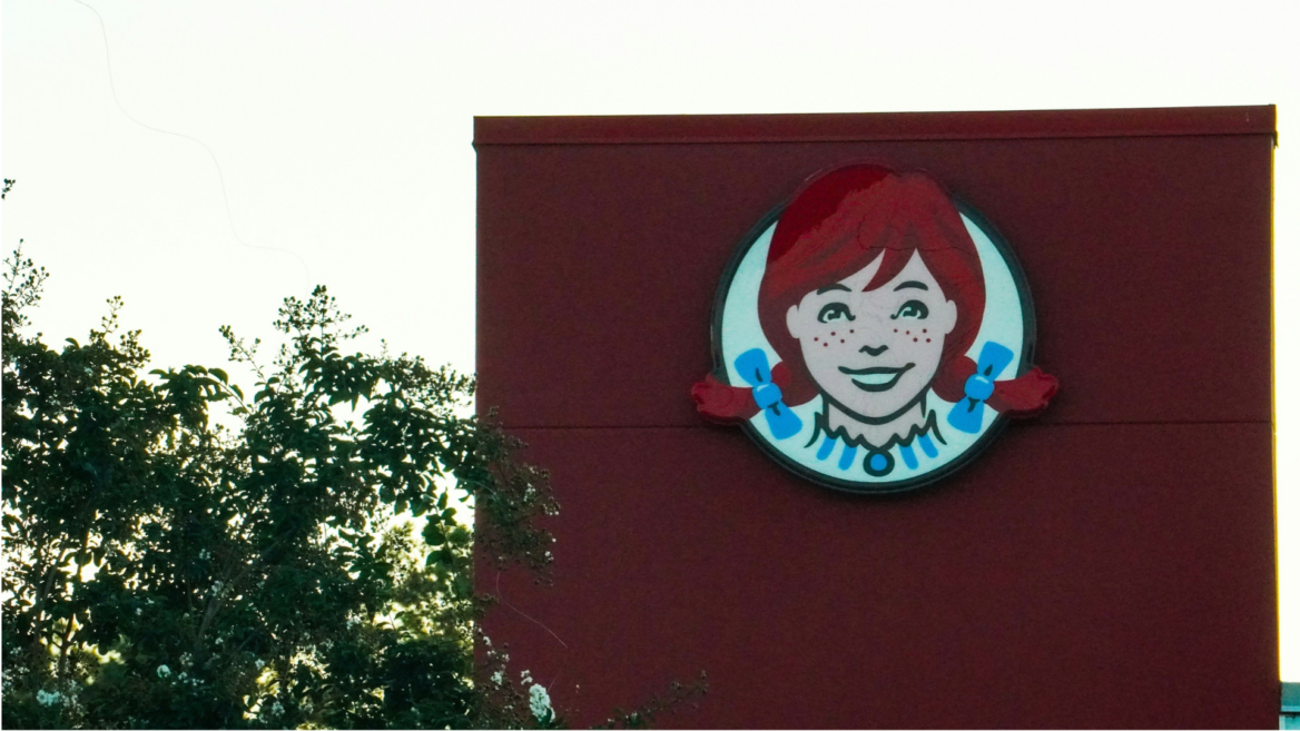 wendy’s logo on red building wall