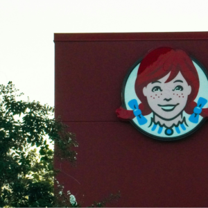 wendy’s logo on red building wall