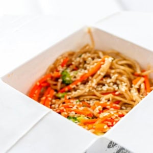 sesame noodles in white takeout box