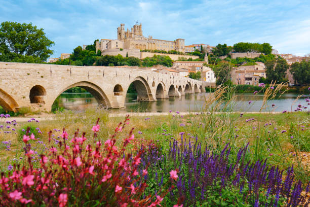 beziers cathedral with pont vieux and orb river france